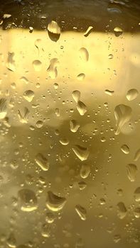 Condensation drops on the illuminated glass surface .Macrophotography. Texture or background