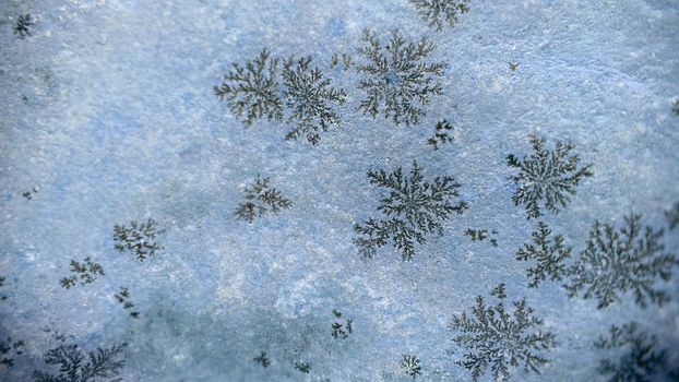 The surface of the stone with a natural natural pattern in the form of snowflakes.Macrophotography.Texture or background.