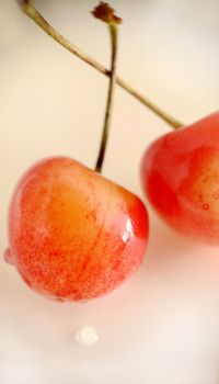 Close-up of ripe cherries selectively standing out against a light background.Macro photography.Texture or background.Selective focus.