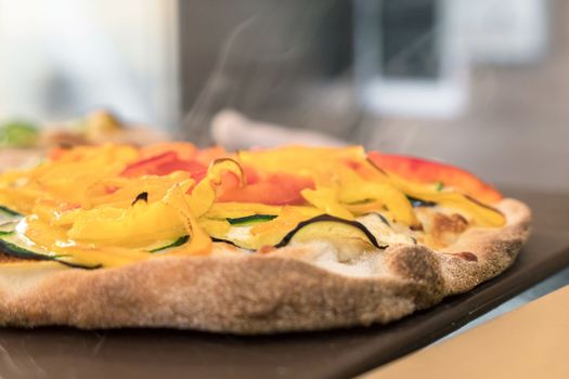 Italian pizza close-up. Close up of italian pizza on cutting board.