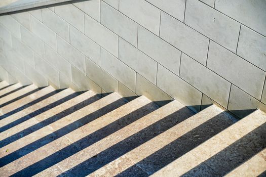 Staircase in the city, black and white pattern on the stairs on a sunny day