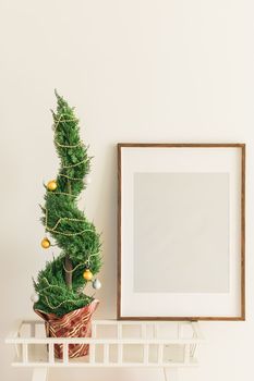 Indoor cypress or thuja in pot is decorating balls like Christmas tree. Alternative trees for christmas . Copy space and space for advertising.