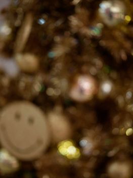 Christmas and Happy new year on blurred bokeh christmas tree . Golden tone . SPACE FOR TEXT 