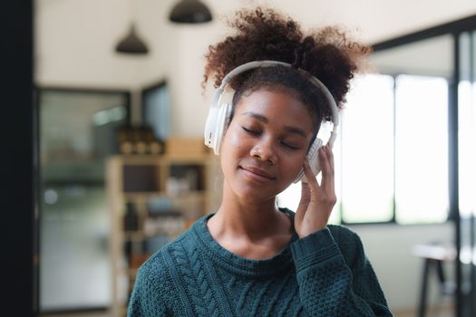 Young Black Woman Listening To Music Online Wearing Wireless Earphones, Enjoying Favorite Song. Playlist, Music Application.