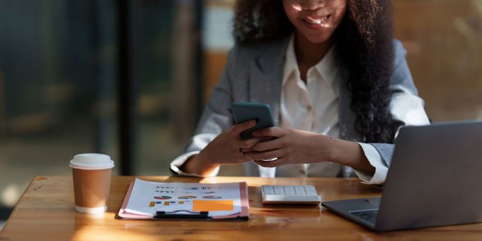 African American businesswoman completes KYC using an online banking program in order to open a digital savings account. The definition of cyber security.