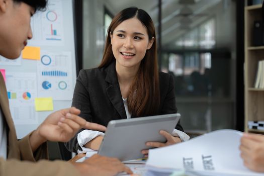 Fund managers team consultation and discuss about analysis Investment stock market by digital tablet.