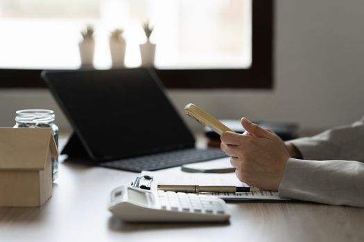 Business woman reading phone message at office.