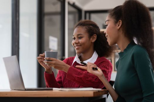 Two Black Business women at casual meeting room discussing and brainstorm idea about marketing. Business consult concept.