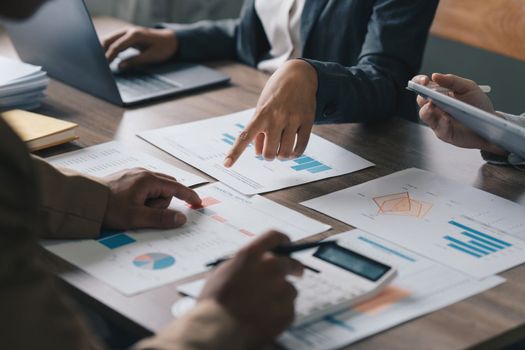 Group of business asian people analysis financial graph on desk at meeting room.