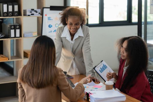 Young African American businesswoman working with partner at office. finance concept.