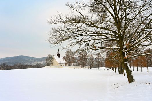 Winter landscape with a beautiful chapel near castle Veveri. Czech Republic city of Brno. The Chapel of the Mother of God.