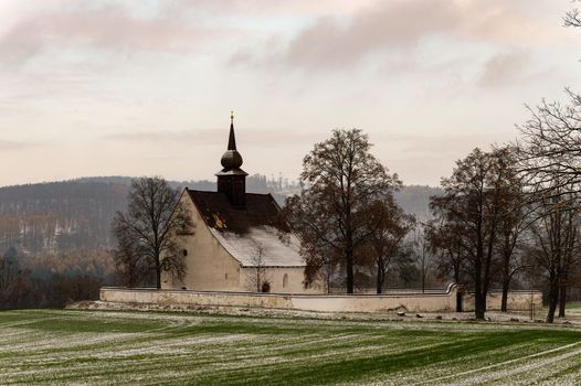 Winter landscape with a beautiful chapel near castle Veveri. Czech Republic city of Brno. The Chapel of the Mother of God.