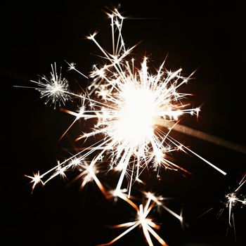 Beautiful abstract shot of sparklers on black background.