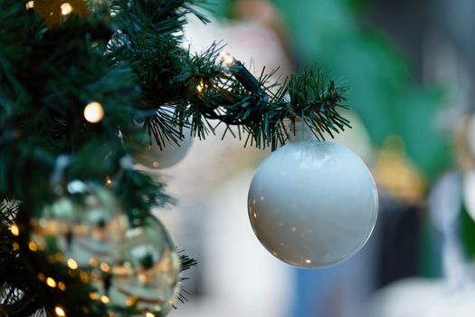 Beautifully decorated Christmas tree with blurred background. Concept for Christmas holidays and winter season.