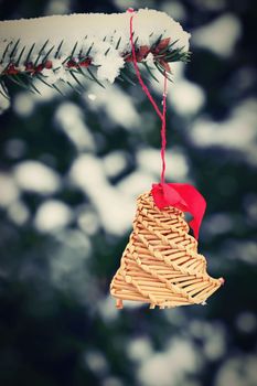 Ornaments and lights on the decorated Christmas tree. 
Christmas decorations on the holiday. Colorful balls garland glowing lamps and red berries on the branches are sprinkled with snow.Festive traditional seamless background for the New Year