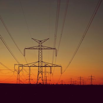 High voltage pylons. Rising energy prices - a concept for industry and energy. Increasing the price of electricity. Concept for industry and energy. The crisis in Europe caused by Russian aggression and the war in Ukraine.