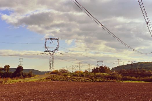 Power plant - electrical energy substation.- High voltage pylons. Concept for technology and industry. Rising energy prices - further rising electricity and energy prices - the energy crisis caused by the war between Russia and Ukraine.