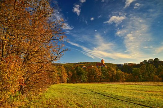 Beautiful Autumn Landscape with Veveri Castle. Natural colorful scenery with sunset. Brno dam-Czech Republic-Europe.