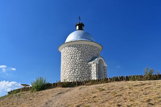 South Moravia - wine region. A beautiful little chapel above the vineyards. Summer landscape with nature in the Czech Republic. (Hradistek - Velke Bilovice)