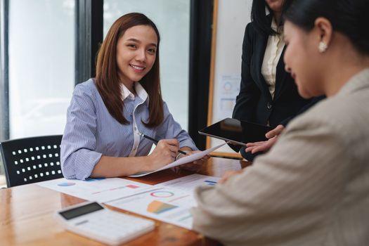 Smart asian business woman smiling at office space. real estate, lawyer, non-profit, marketing.