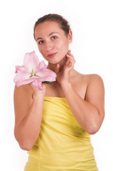 Beauty face of the young beautiful woman with flower on a white background