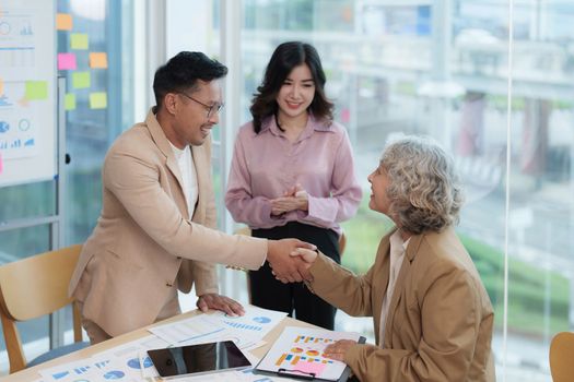 Image businessmans handshake. Successful business people handshaking after good deal.