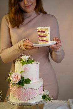 festive wedding two-tiered cake decorated with fresh flowers