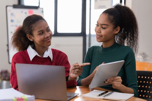 Two Black Business women at casual meeting room discussing and brainstorm idea about marketing. Business consult concept.