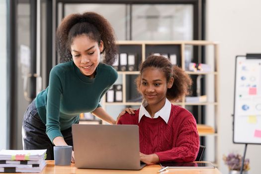 Two Black Business women at casual meeting room discussing and brainstorm idea about marketing. Business consult concept.