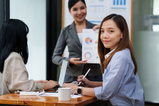 Smart asian business woman smiling at office space. real estate, lawyer, non-profit, marketing.