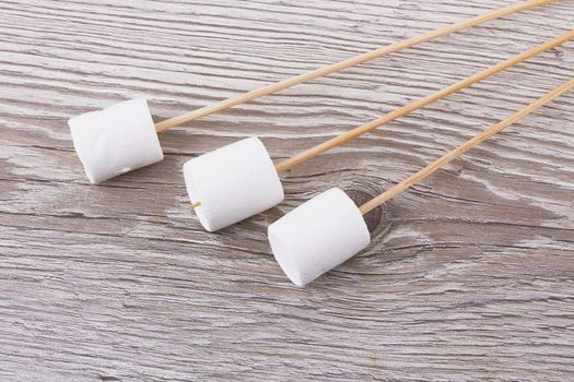 Marshmallows on a wooden background