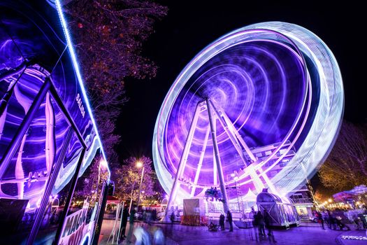 GRANADA, ANDALUSIA, SPAIN. DECEMBER 30TH, 2019 Ferris wheel at night at the fair