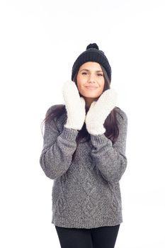 pretty brunette woman with a woolen hat a sweater and gloves smiling and cheerful