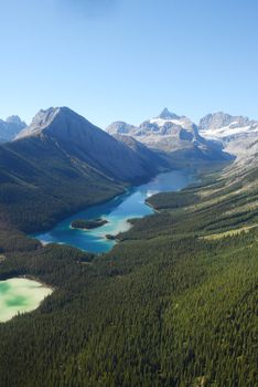 view of a remote lake in alberta wilderness, taken from helicopter