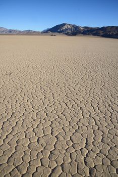 dry mud crack in racetrack playa in death valley national park