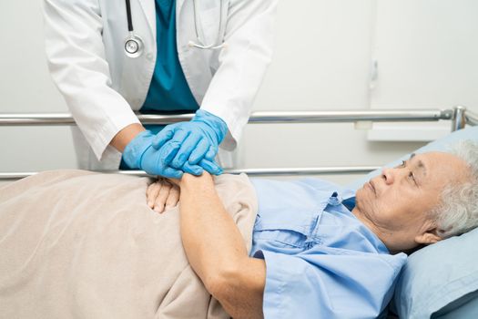 Holding hands Asian senior or elderly old lady woman patient with love, care, encourage and empathy at nursing hospital ward, healthy strong medical concept