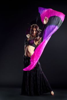 Full length portrait of oriental dancer with shawl