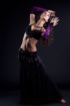 Full length portrait of beautiful oriental dancer