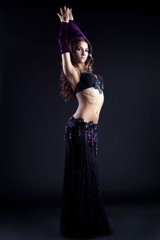 Full length portrait of sexy oriental dancer