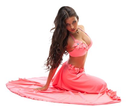 Portrait of sexy oriental dancer in pink costume. Isolated on white