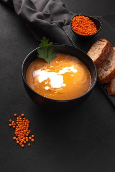 Vegetarian lentil soup is healthy eating. Cream soup with sour cream and cream.