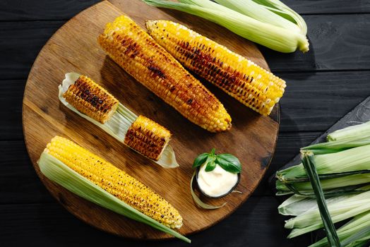 Grilled food. Charcoal and grilled corn. top view.