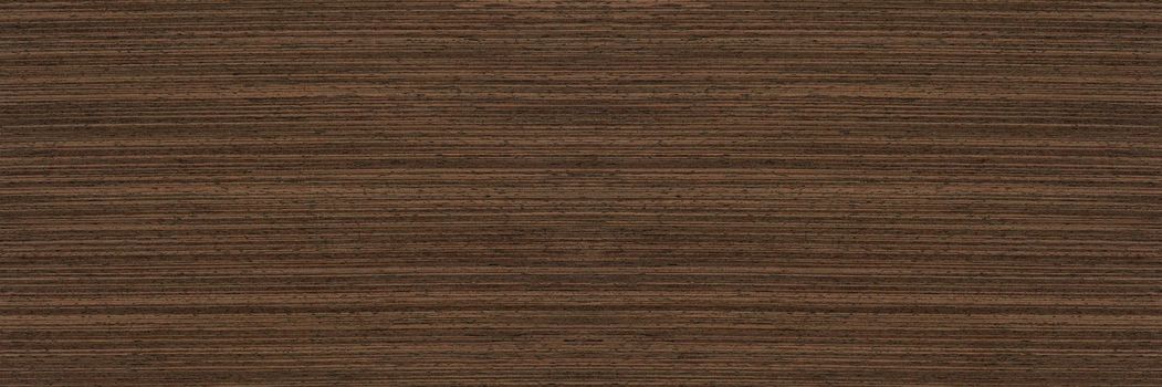 Texture of wenge wood. Dark brown wood for furniture or flooring. Close-up of a Wenge wooden plank, top view