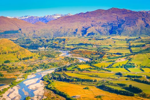 Above Queenstown countryside and river in south Island, Otago, New Zealand at sunset