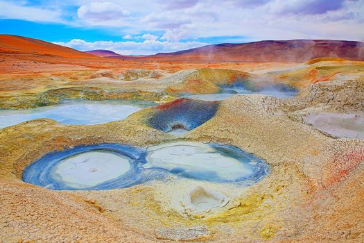 Geysers in Bolivia altiplano, dramatic landscape of bolivian Andes near Atacama of Chile