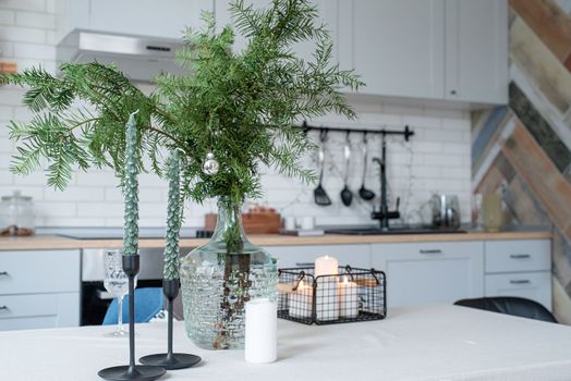 Merry Christmas and Happy New Year. Christmas tree with presents and lights in light and airy living room next to the window