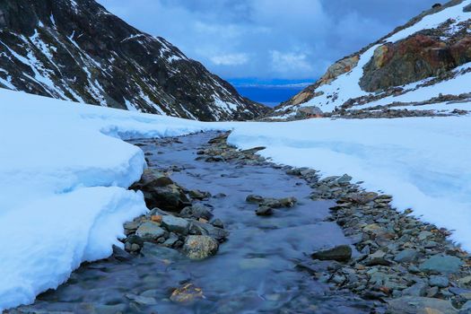 Melting frozen and peaceful river, Andes landscape in Tierra Del fuego, Ushuaia, Argentina, South America