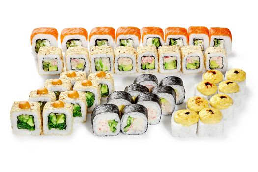 Set of delicious Japanese sushi roll for company with salmon, crab surimi, cheese, vegetables and hiyashi wakame seasoned with spicy sauce and unagi on white background