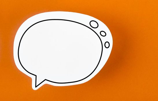 Speech bubble with copy space communication talking speaking concepts on orange colour background.
