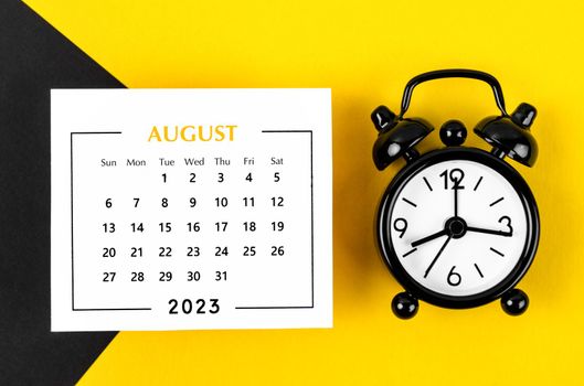 August 2023 Monthly calendar for 2023 year with black colour alarm clock on beautiful background.